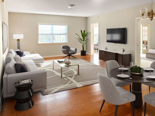 A beautifully designed modern living room featuring minimalist furniture and ample natural light.