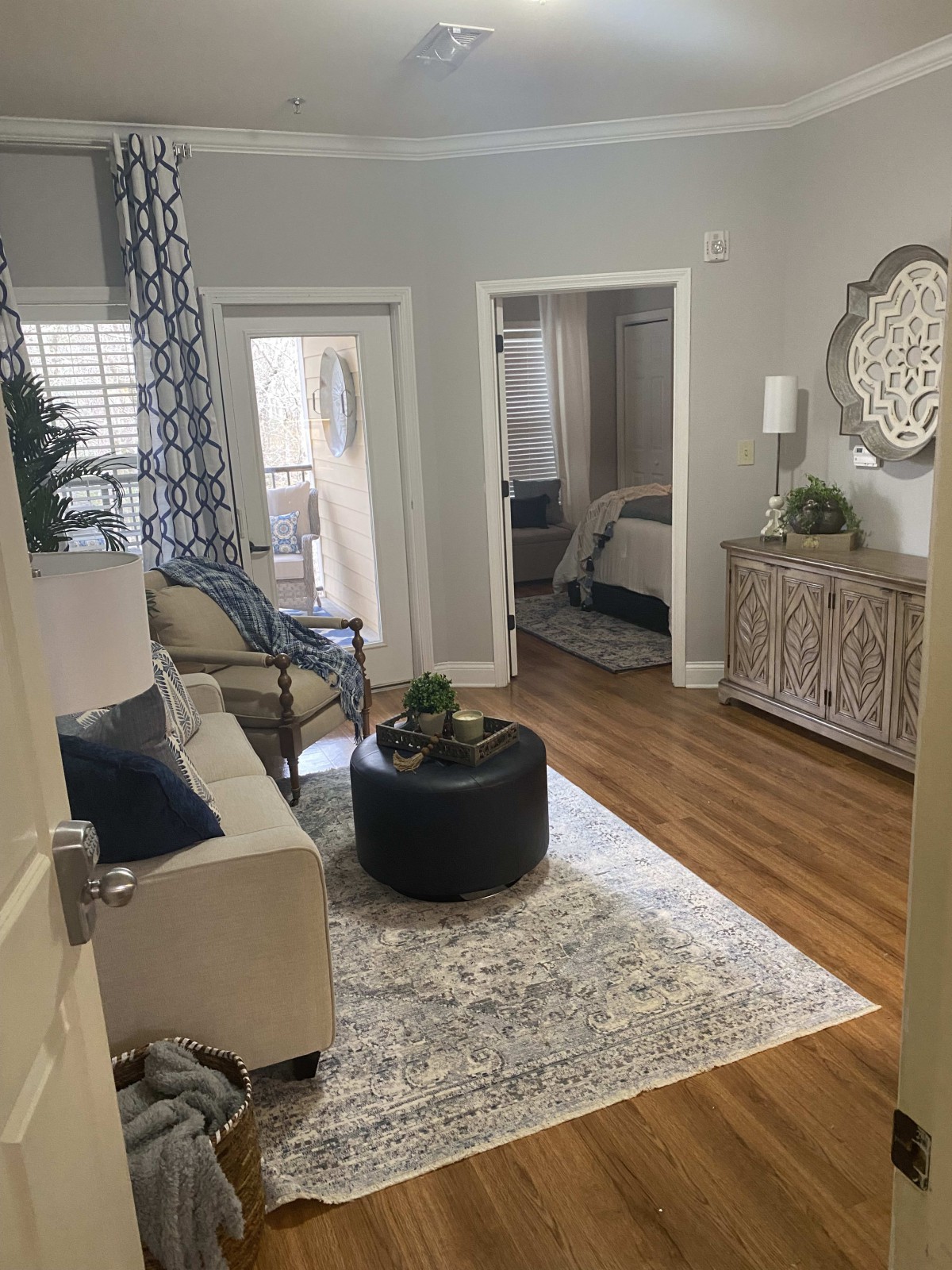 A cozy living room with modern decor and hardwood flooring.