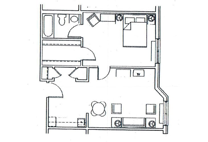 A simple floor plan of an apartment featuring a bedroom, bathroom, and living area.