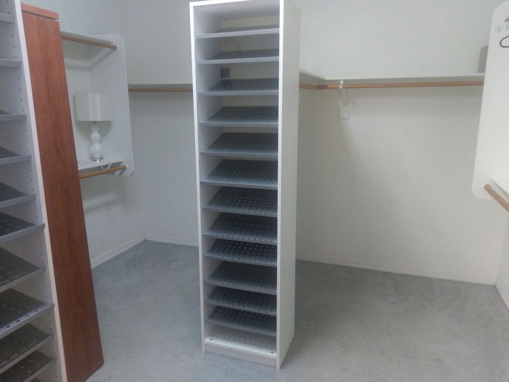 An empty shelving unit in a closet for organization and storage.
