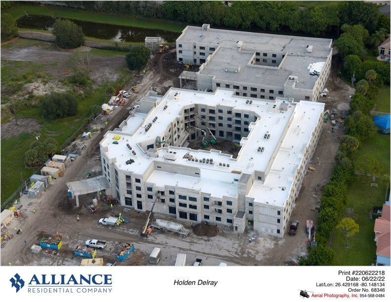 Aerial view of a construction site for a large building complex.