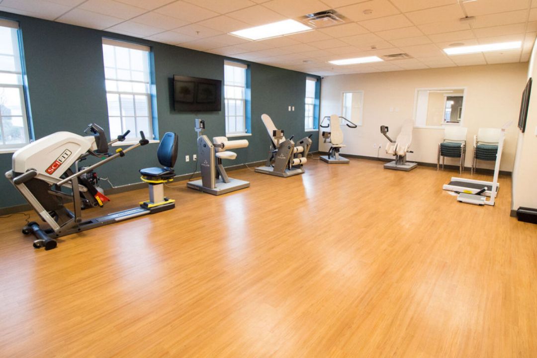 An empty fitness center with various exercise machines.