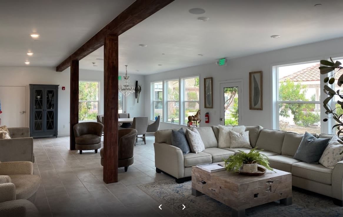 A modern living room with comfortable seating and natural light.