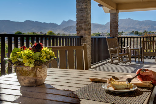A serene outdoor setting with a beautiful mountain backdrop, perfect for enjoying a meal and the fresh air.