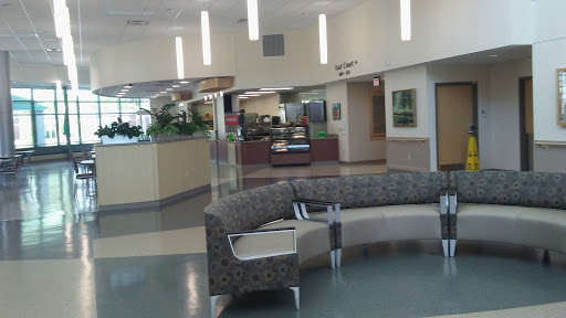 A modern waiting area in a healthcare facility, featuring comfortable seating and a spacious design.