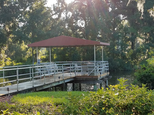 A serene gazebo by the water, basking in the warm sunlight.