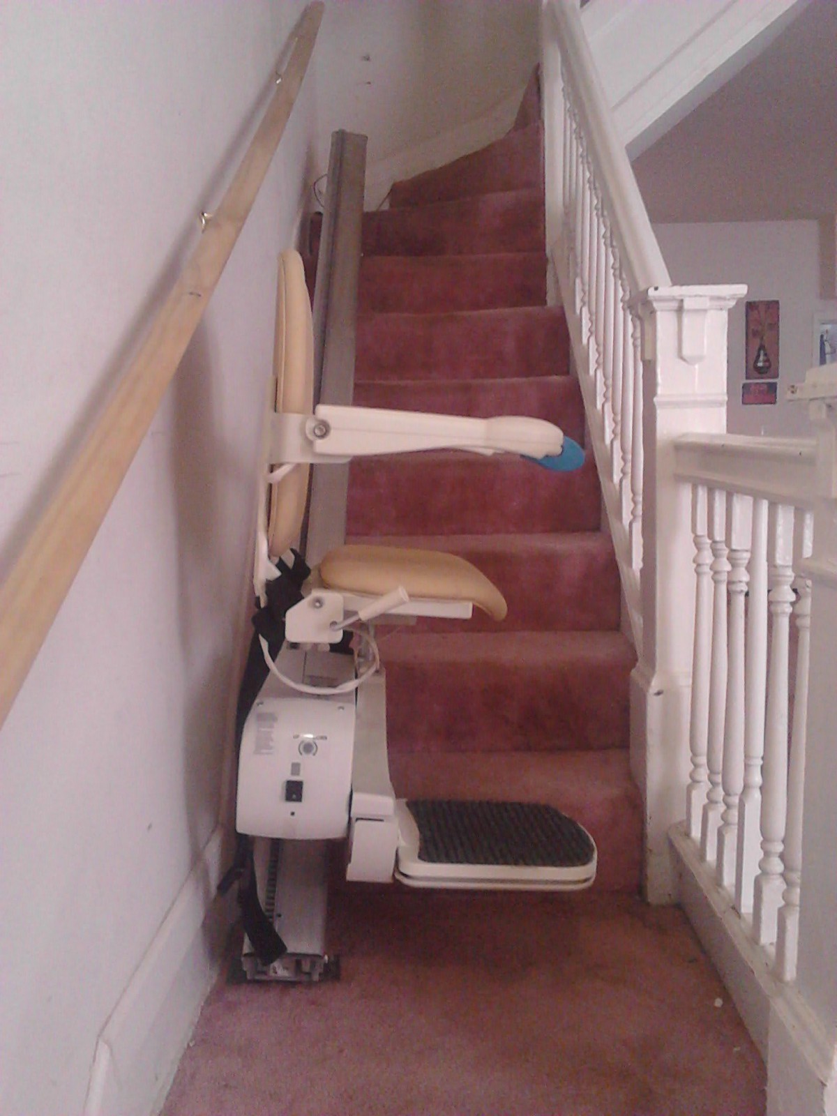 A stairlift installed on a residential staircase to assist with mobility.
