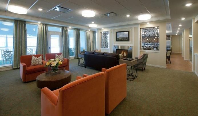 A cozy and modern living room featuring a fireplace, comfortable seating, and stylish decor.