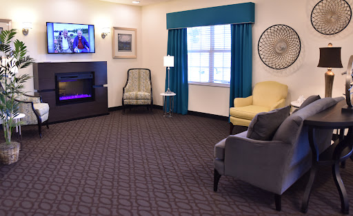 A cozy living room with comfortable seating and a modern television.