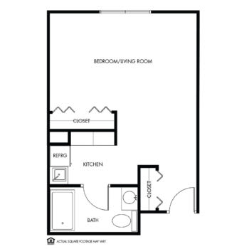 Studio apartment floor plan with designated living and kitchen areas.