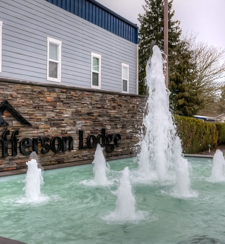 A view of a fountain in front of the Jefferson Lodge building.