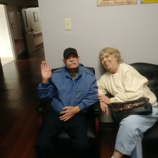 Two individuals enjoying a moment together in a comfortable setting.