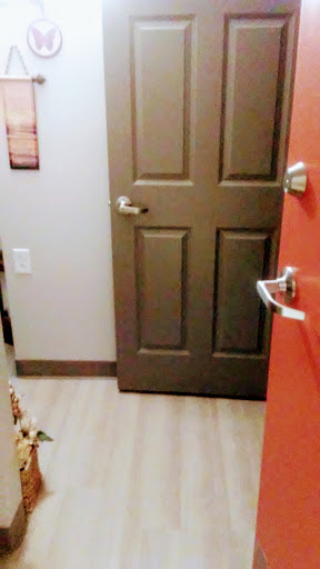 A view of a doorway leading into an interior space.