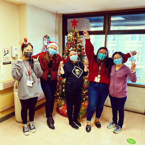 A cheerful group celebrating the holiday season with festive decorations.