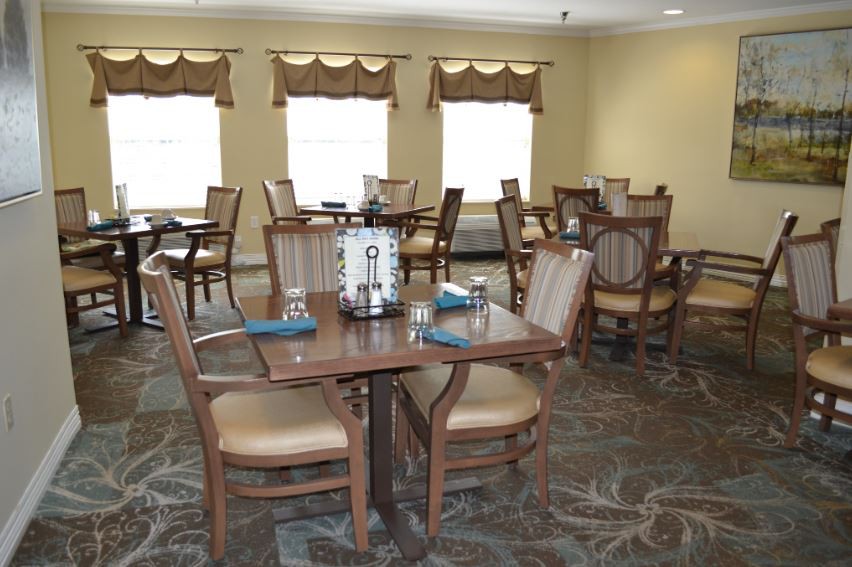 A cozy restaurant dining area with neatly arranged tables and chairs.
