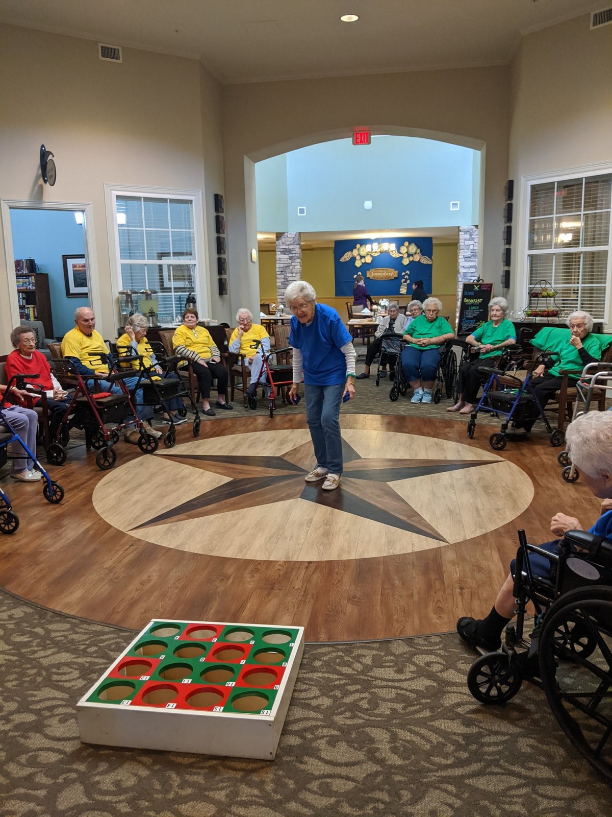A group of seniors enjoying a game together in an indoor community setting.