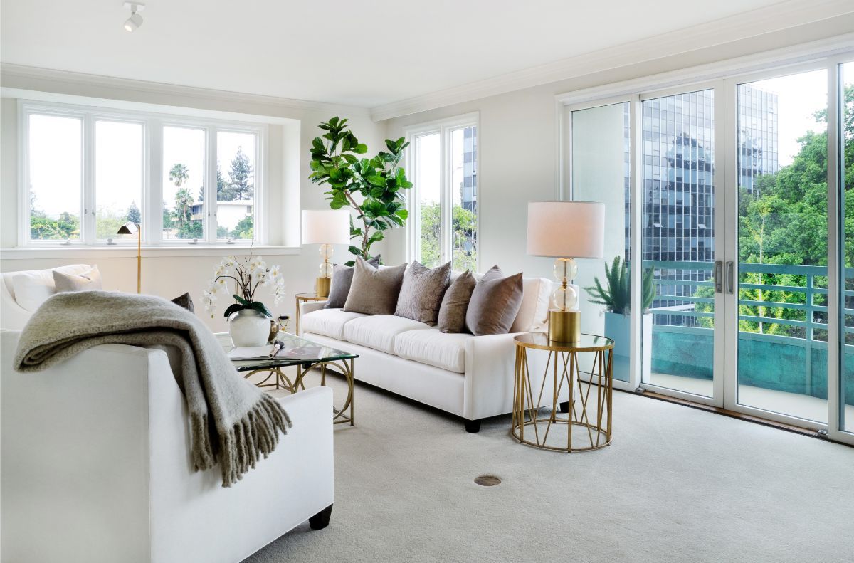 A bright and modern living room with stylish furniture and decor.