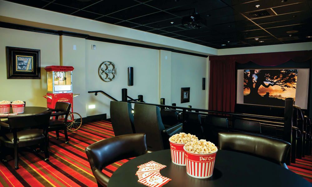 A cozy home theater setup with popcorn and comfortable seating.