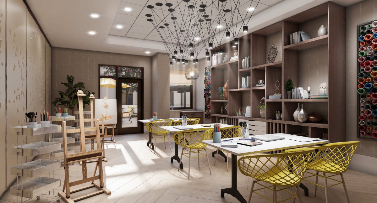 A modern and stylish workspace with bright yellow chairs and innovative lighting.