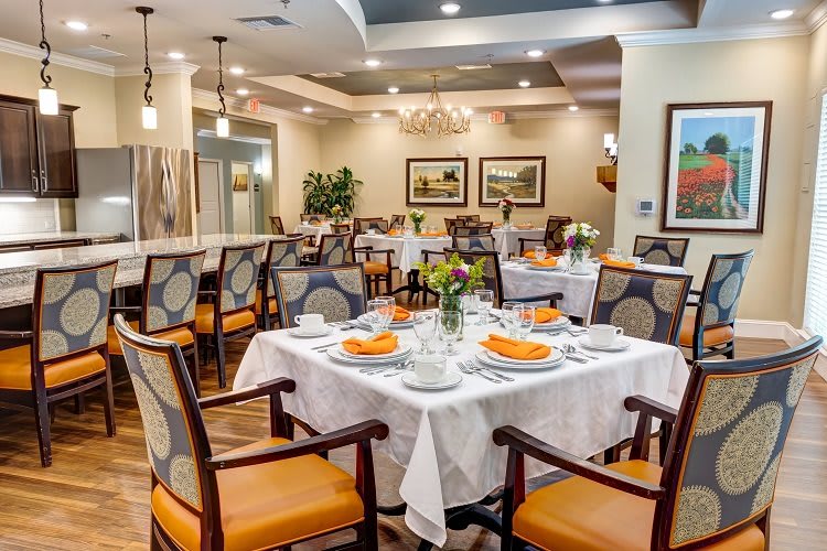 An elegant dining room with neatly set tables and stylish decor.