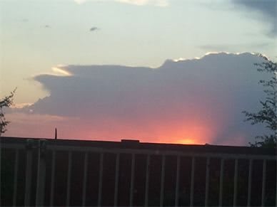 A beautiful sunset with clouds silhouetted against the colorful sky.