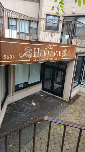 The storefront of 'The Heritage', showcasing its sign and entrance.