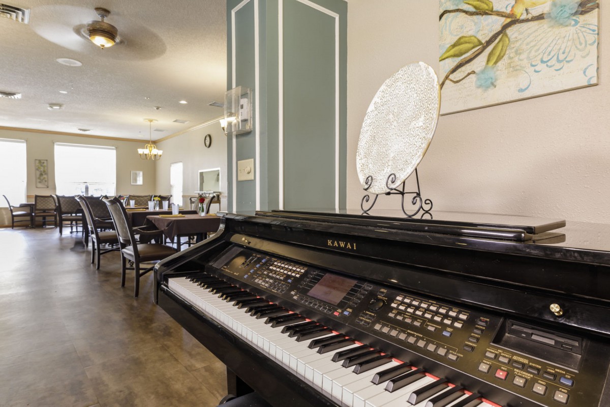 A stylish interior featuring a digital piano and elegant decor.