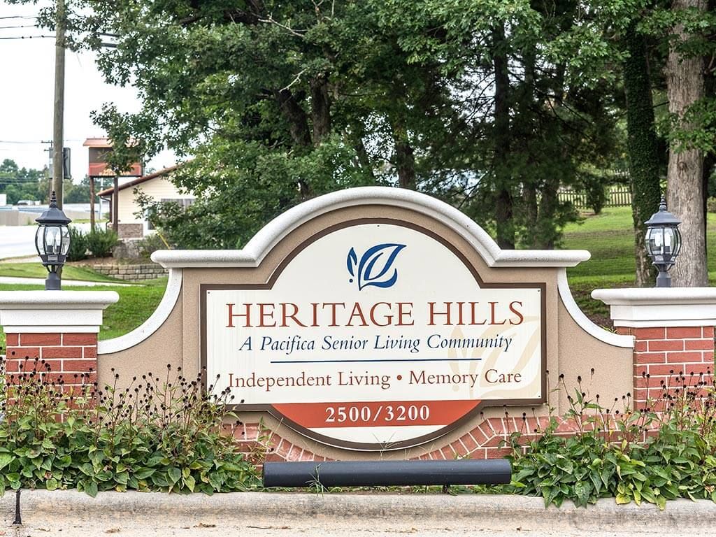 Entrance sign for Heritage Hills, a senior living community offering independent living, assisted living, and memory care.