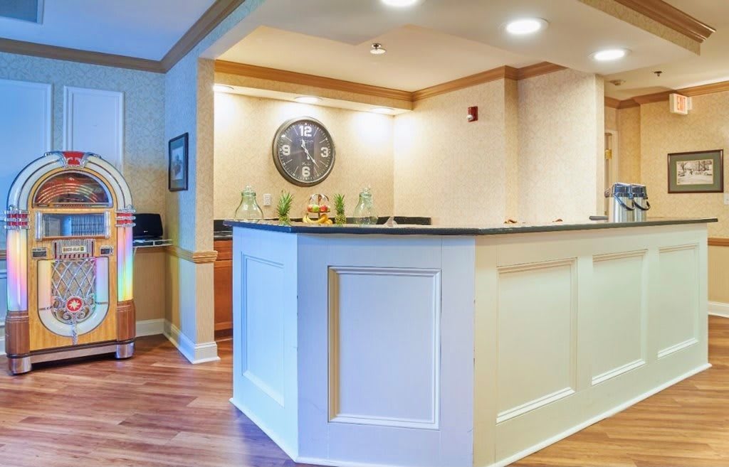 A modern reception area with a counter and stylish lighting.