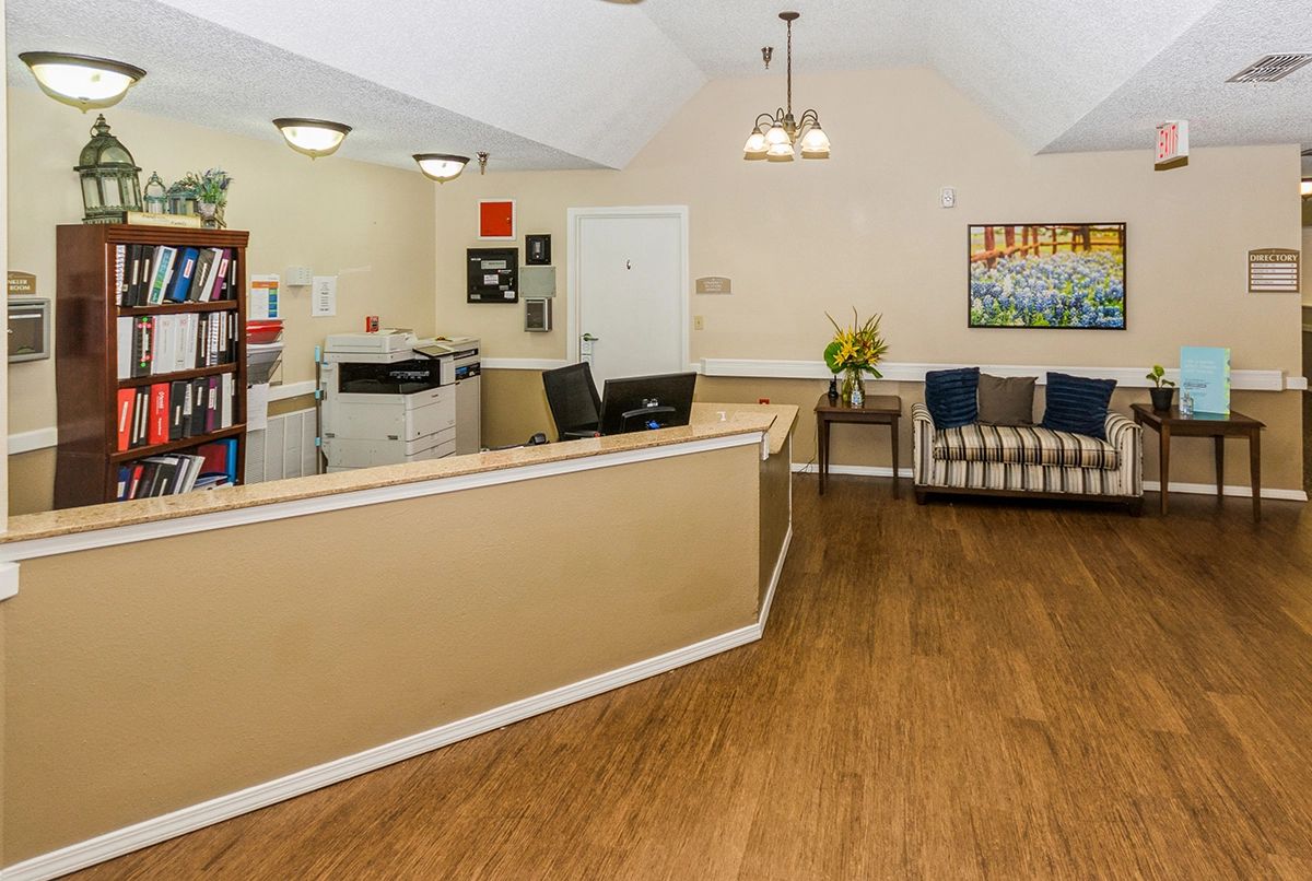 A welcoming reception area with a front desk and seating arrangement.