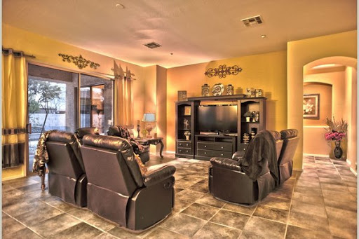 A cozy living room featuring comfortable recliners and a stylish entertainment center.