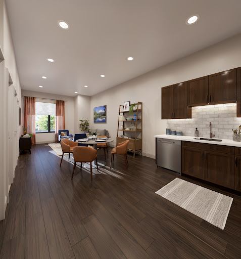 A beautifully designed open-concept living area featuring a modern kitchen and cozy seating arrangement.