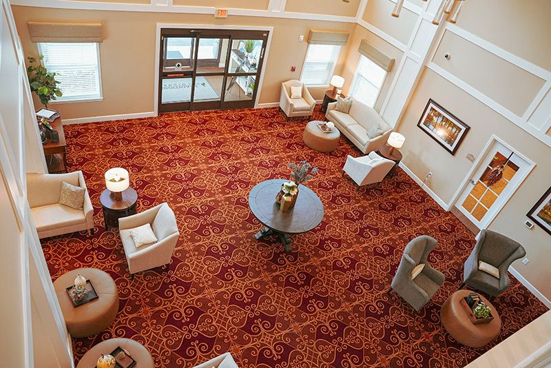 An overhead view of a hotel lobby featuring comfortable seating and elegant decor.