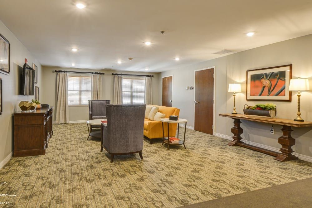 A well-lit living room with comfortable seating and tasteful decor.