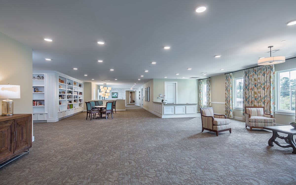 A spacious, well-lit lobby with comfortable seating and large windows.