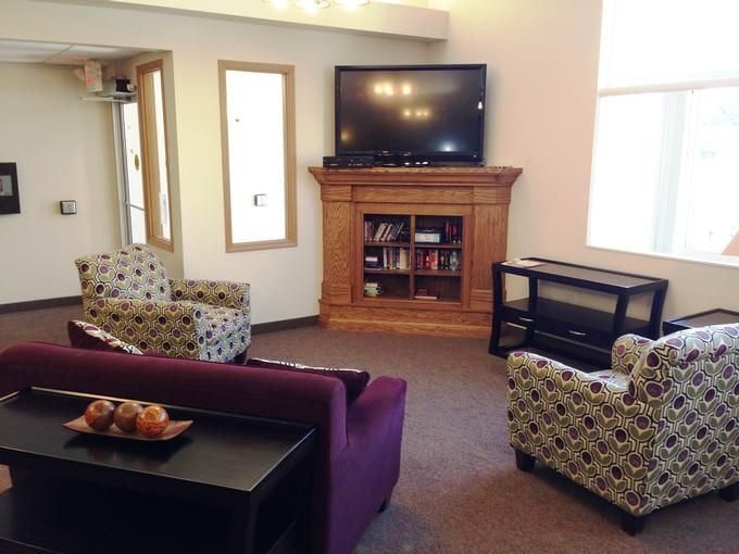 A cozy living room with comfortable seating and a television.