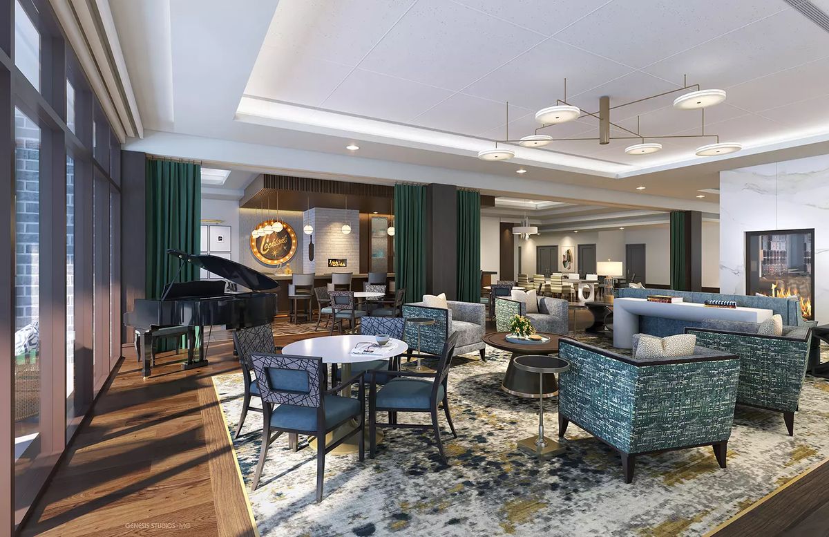 A modern hotel lobby with elegant seating and a grand piano.