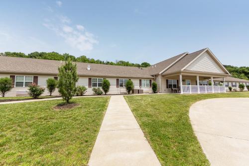 A well-kept exterior view of a residential building with landscaped pathways.