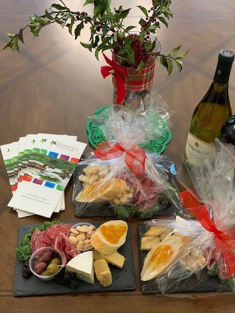 A festive charcuterie spread with wine, perfect for holiday gifting.