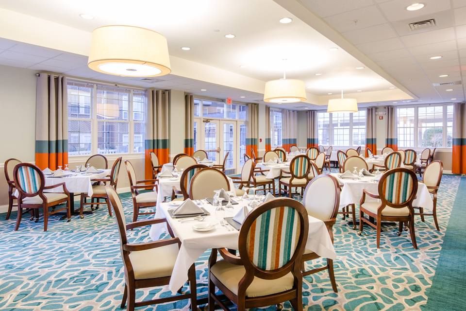 A beautifully designed restaurant dining area with elegant furnishings and modern lighting.