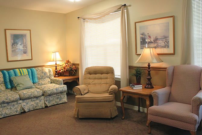 A cozy living room with comfortable seating and warm lighting.
