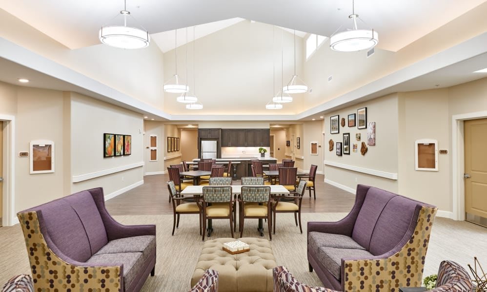 A modern and spacious dining area with elegant seating arrangements and contemporary lighting.
