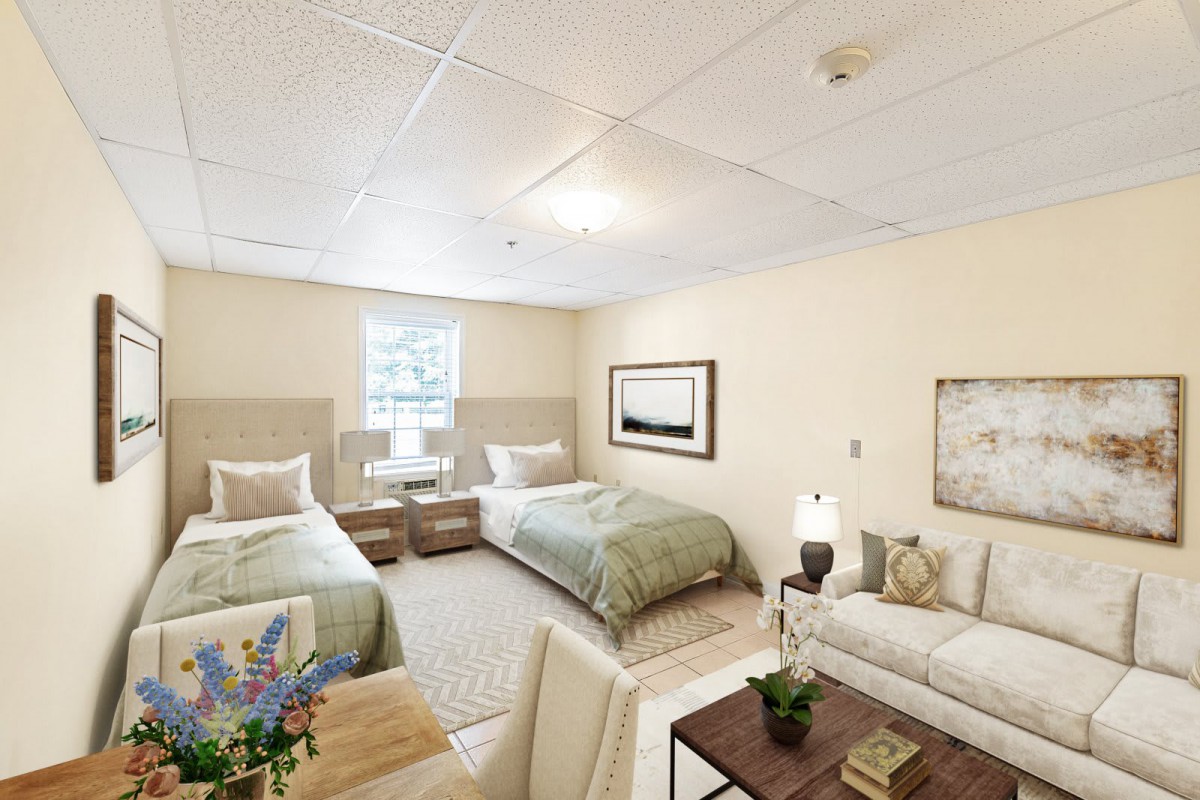 A cozy bedroom featuring two twin beds, a sofa, and stylish decor.