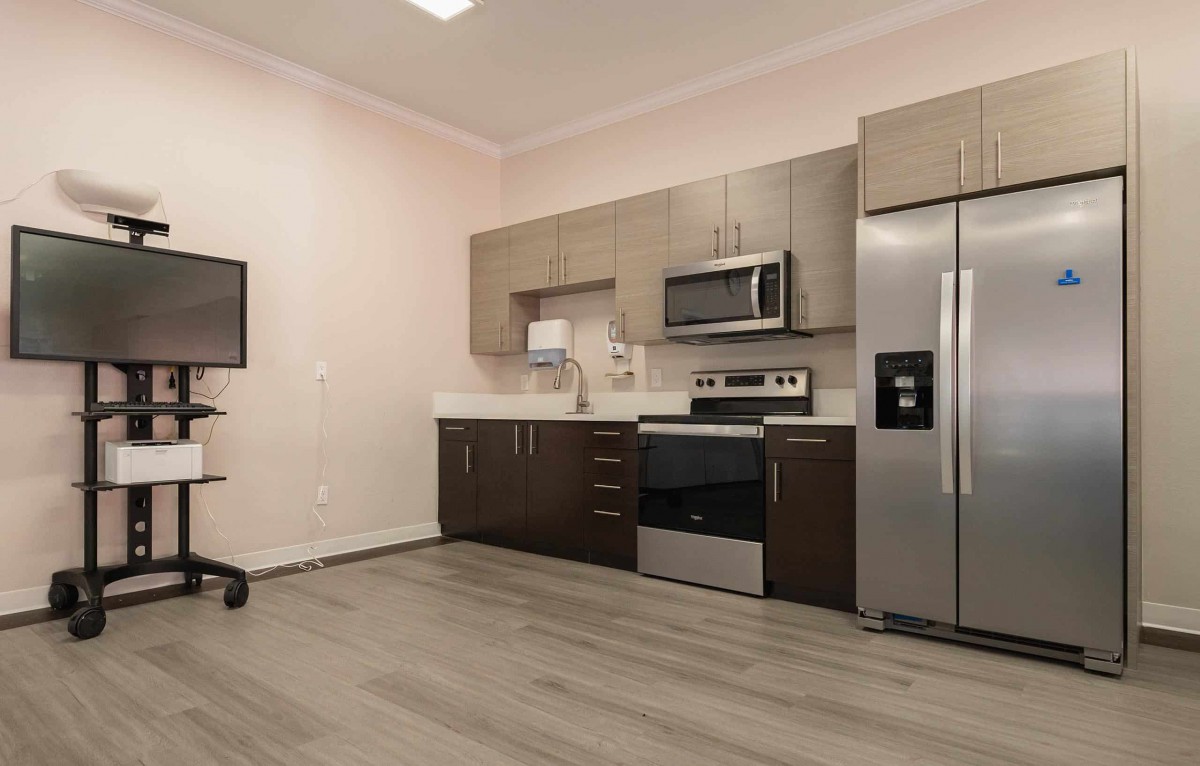 A modern kitchen featuring stainless steel appliances and contemporary cabinetry.