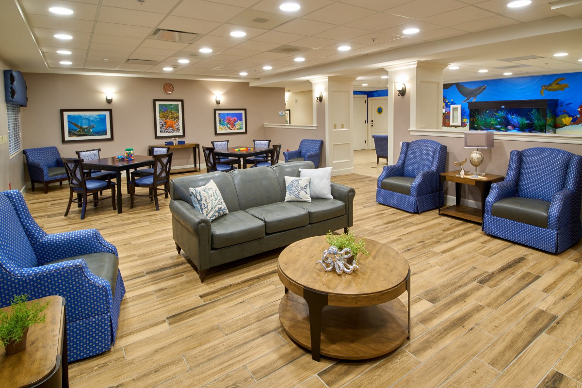 A cozy and well-lit living room area with comfortable seating and stylish decor.