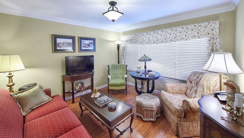 A cozy living room with comfortable seating and a television.