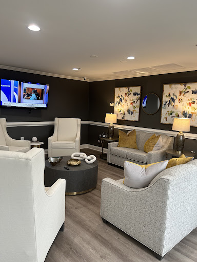 A stylish and inviting living room setup featuring contemporary furniture and decorative artwork.