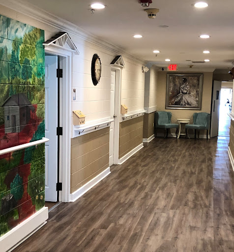 A vibrant hallway featuring colorful artwork and modern decor.