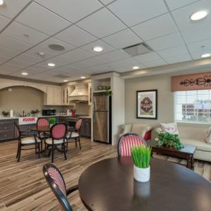 A modern and cozy interior space featuring a kitchen, dining area, and living room.