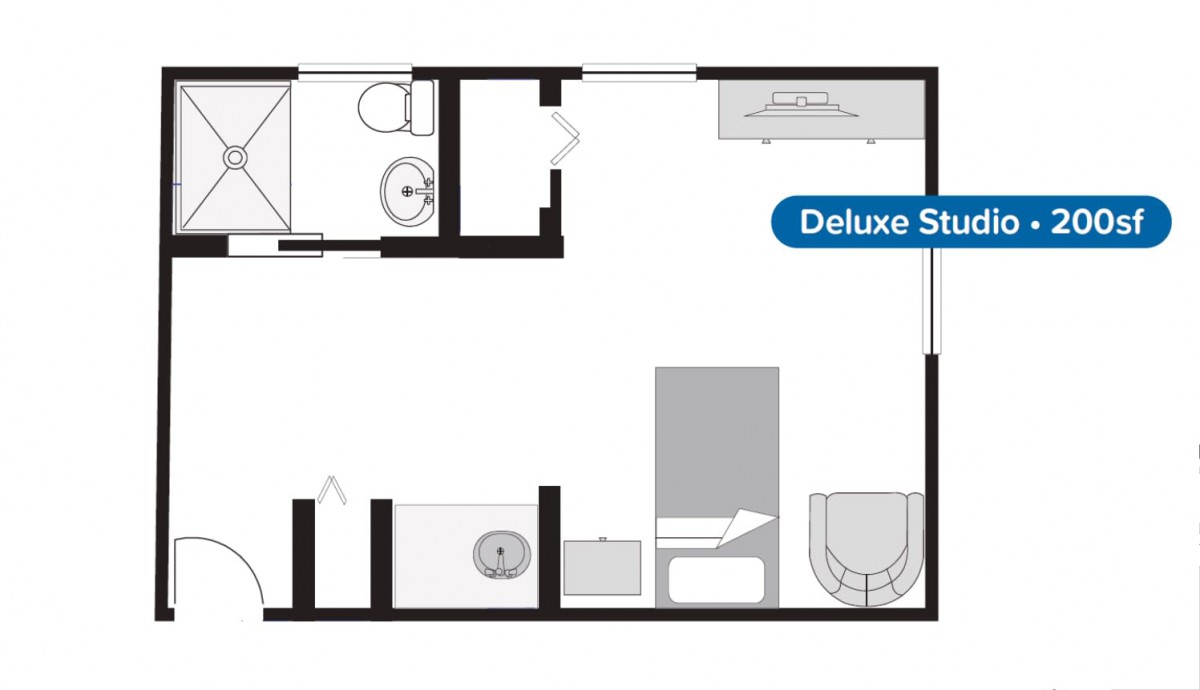 A floor plan of a deluxe suite featuring a bedroom and bathroom layout.